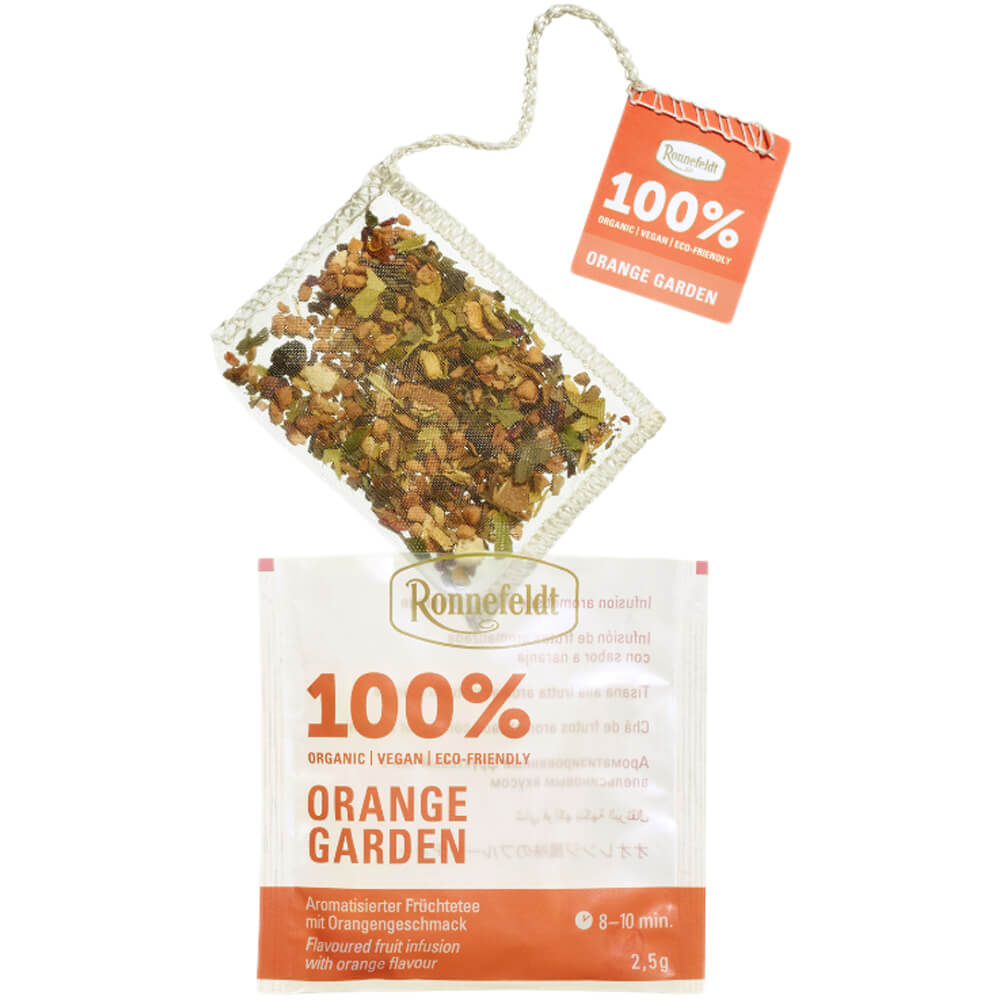 Ronnefeldt Orange Garden bio Teebeutel mit sichtbarer Früchteteemischung, orangefarbenem Fähnchen und Aromaschutzhülle